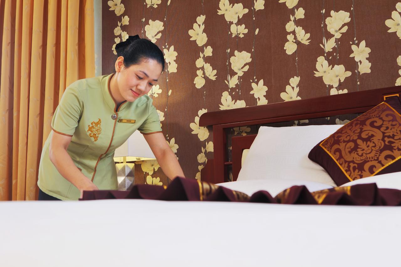 Rex Hotel Ho Chi Minh City Exterior photo A chambermaid making a bed